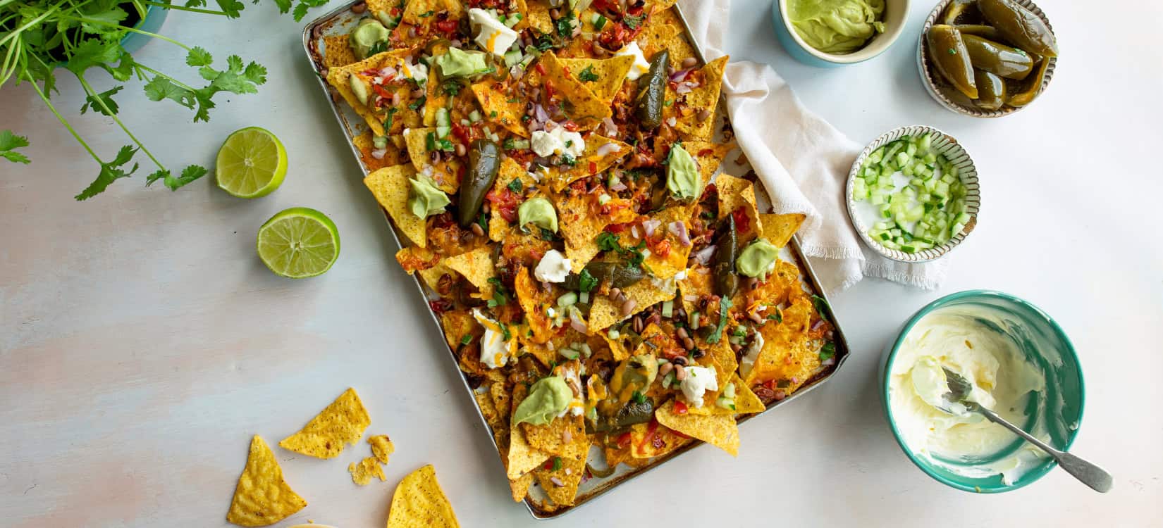 Fully Loaded PEPPADEW® Sweet Jalapeño Pepper Nachos Traybake